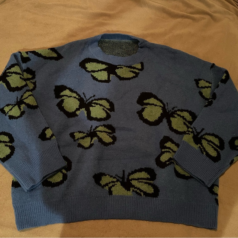 Blue and green colored butterfly sweater